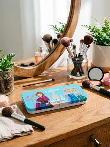 Blue character licensed rectangular Lip Smacker tin in a beauty setting