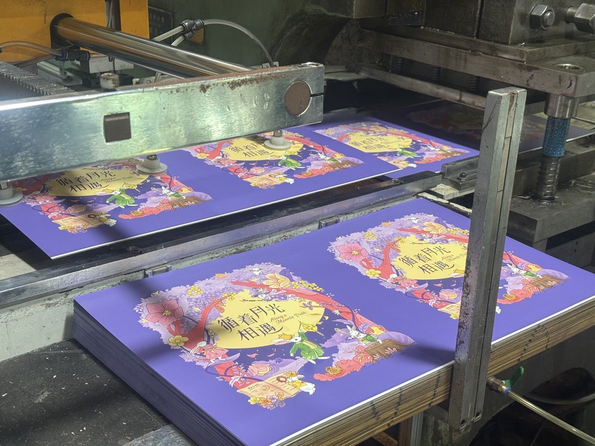 Printed tinplate sheets being prepared for custom tin production