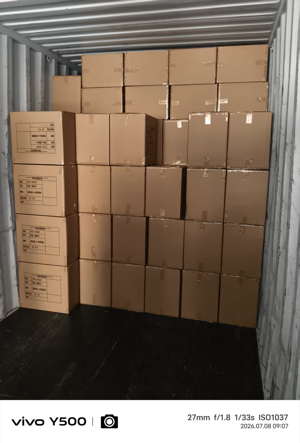 Export cartons loaded into a shipping container at Junmei